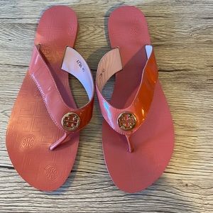 Salmon colored Tory Burch flip flops